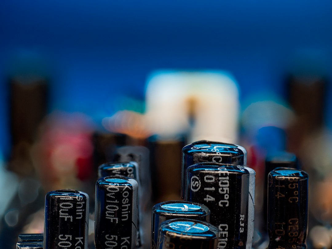 AC Capacitor Calculator reference — close-up of run capacitors used in HVAC compressor and fan motor circuits